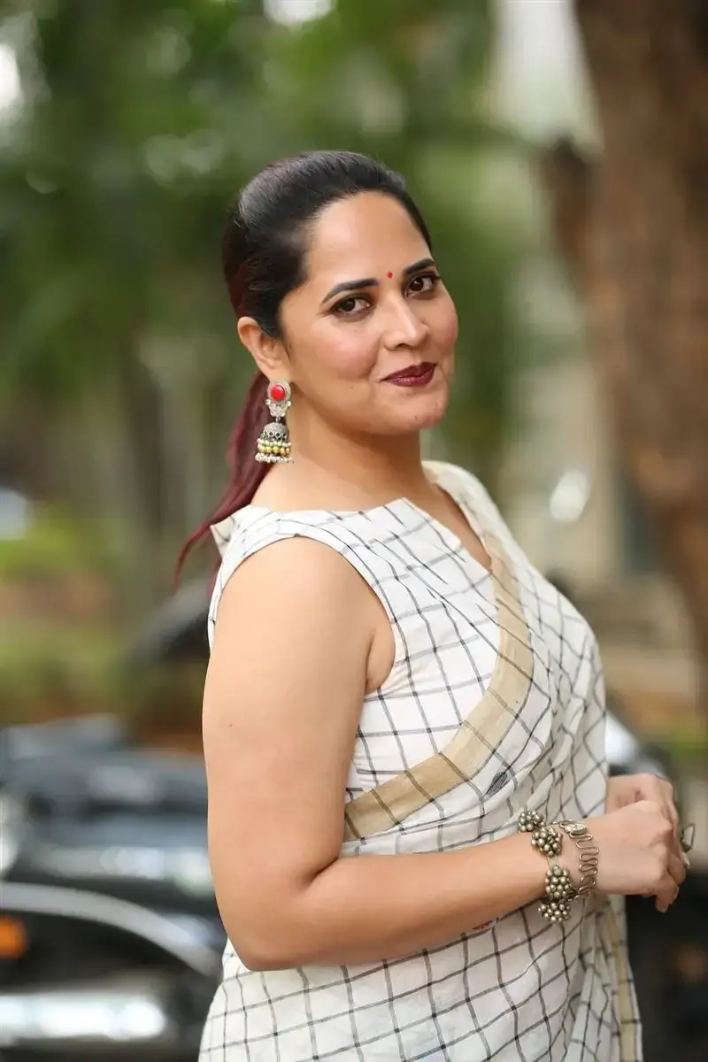 Anasuya Bharadwaj in White Saree at Razakar Movie Launch